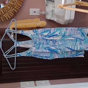 A Lilly Pulitzer halter top is definitely the only brand and colors to wear.